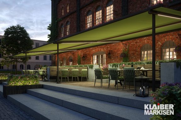 Textile Überdachung in grün über eine Terrasse